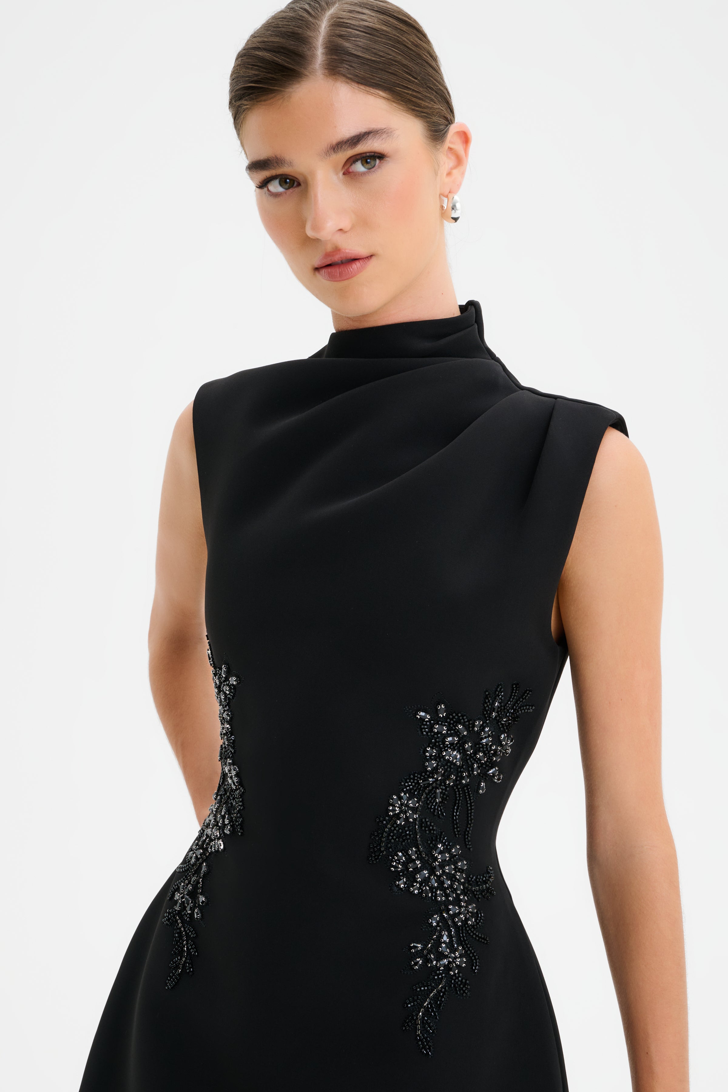 AMBAR Asymmetric High Neck Embellished Tulip Mini Dress in Black